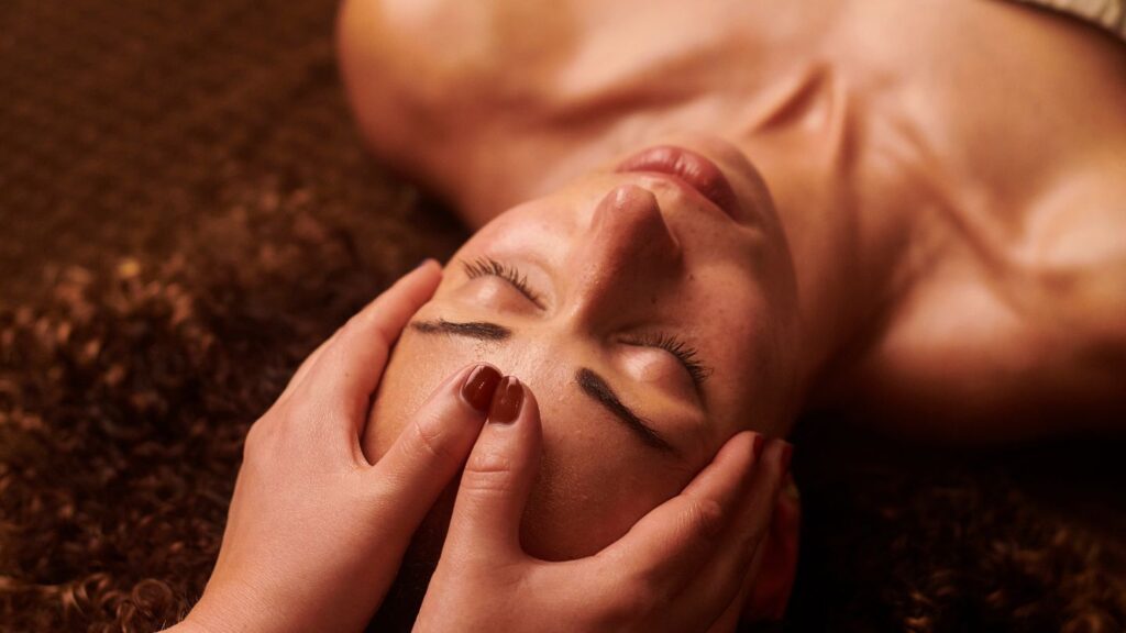 Headache relief massage focusing on the neck and scalp at Ideal Wellness in Juno Beach