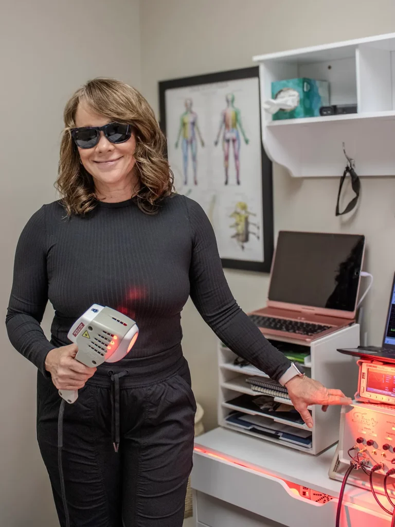 Stephanie Wood providing Firefly Light Therapy at Ideal Wellness in Juno Beach, FL.
